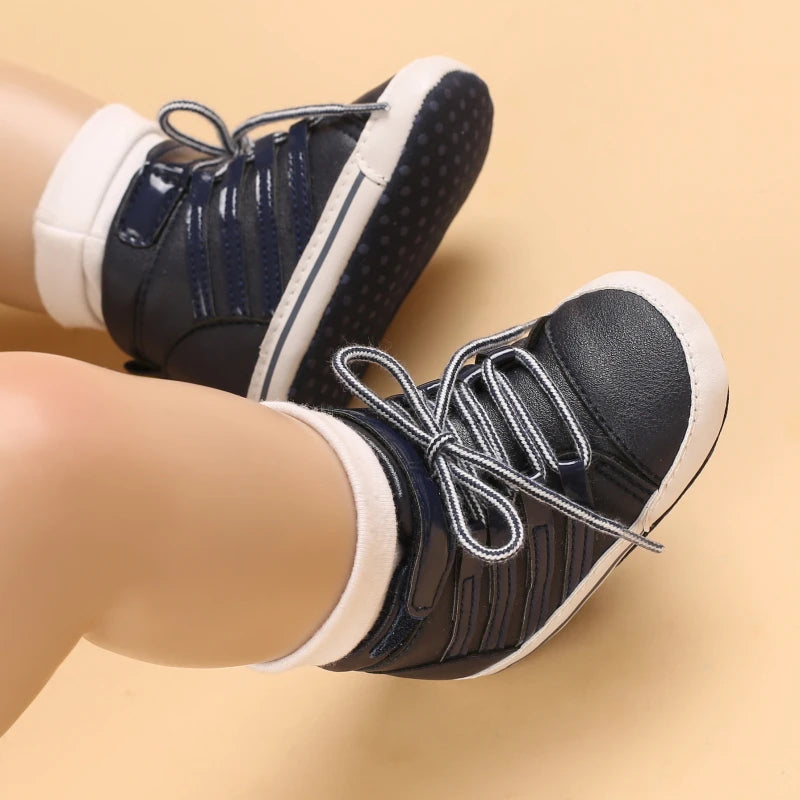 Black and white shoes worn on a beige background