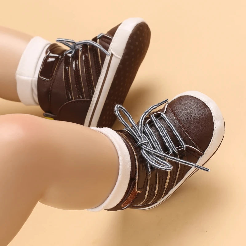 Brown shoes with white laces worn on a beige background