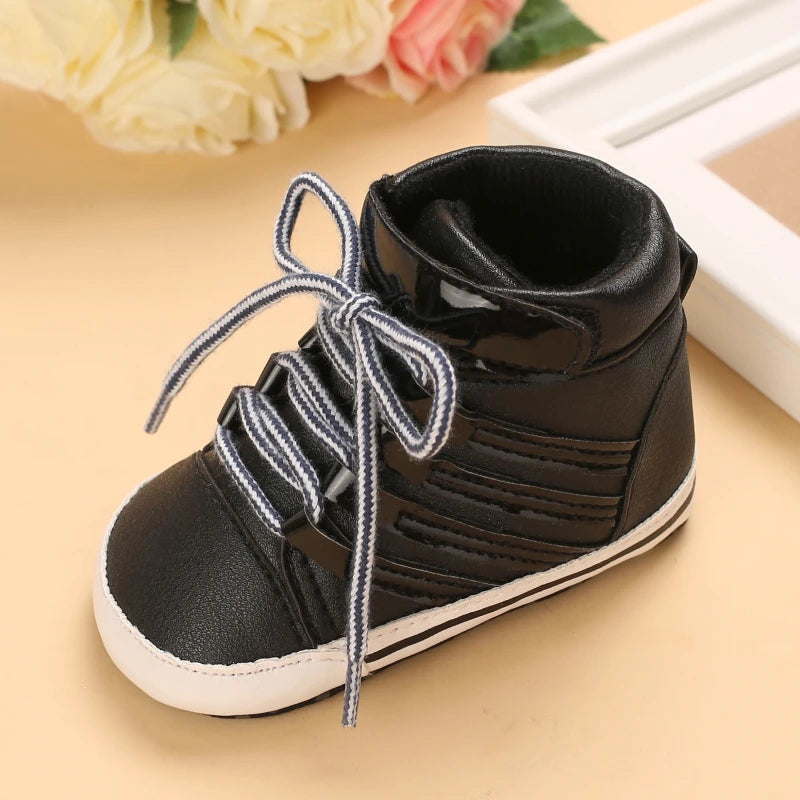 Black high-top sneaker with white sole on a beige surface
