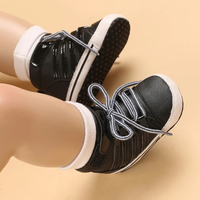 Black sneakers with white soles worn on a beige background