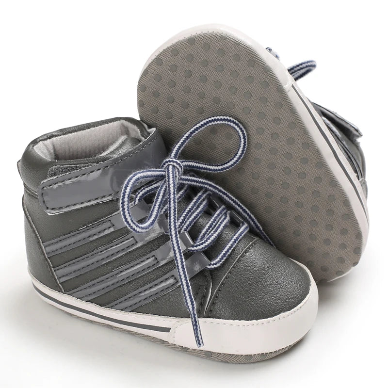 Gray high-top sneakers with white soles on a white background
