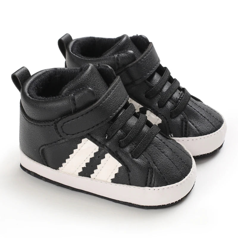 Black high-top sneakers with white stripes on a white background