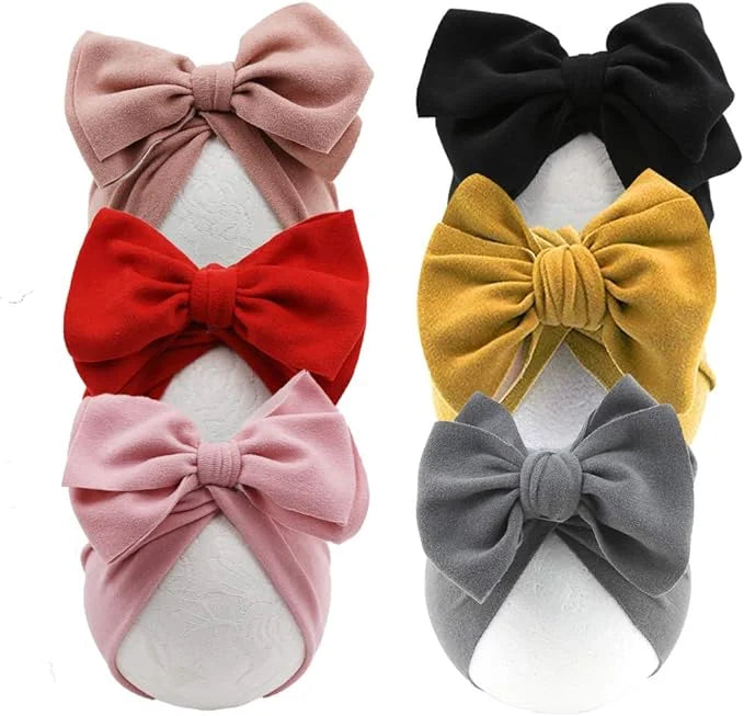 Set of colorful hair bows on white background