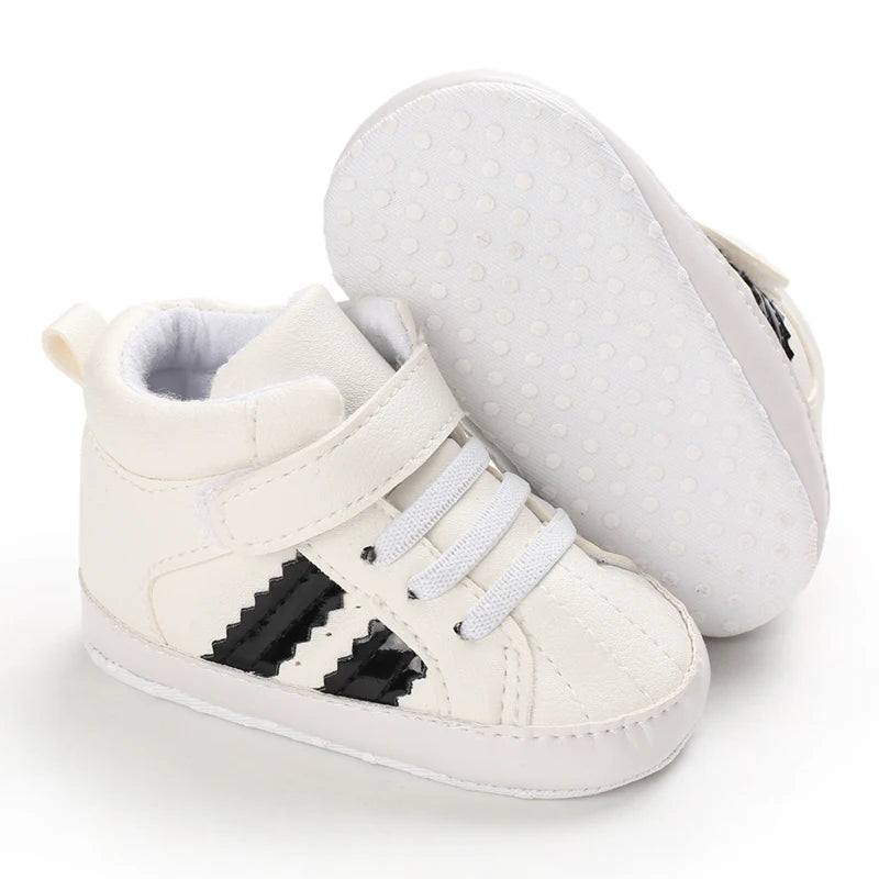 White high-top sneakers with black pixelated design on a white background