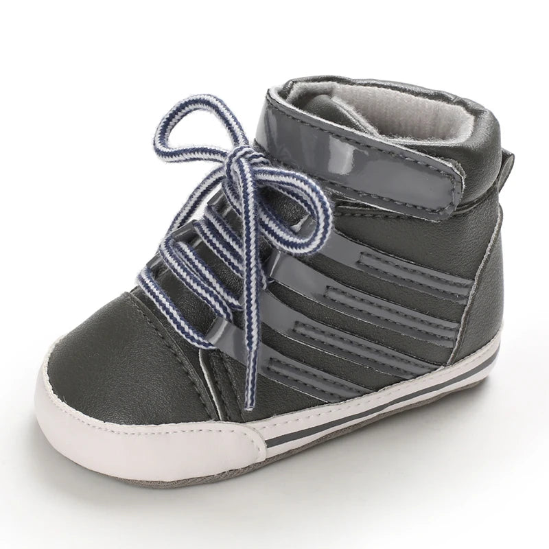 Gray high-top sneaker with blue laces on a white background