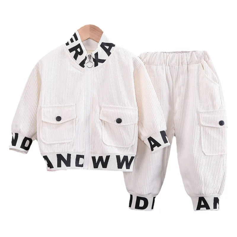 White corduroy jacket and pants set with black lettering on a white background