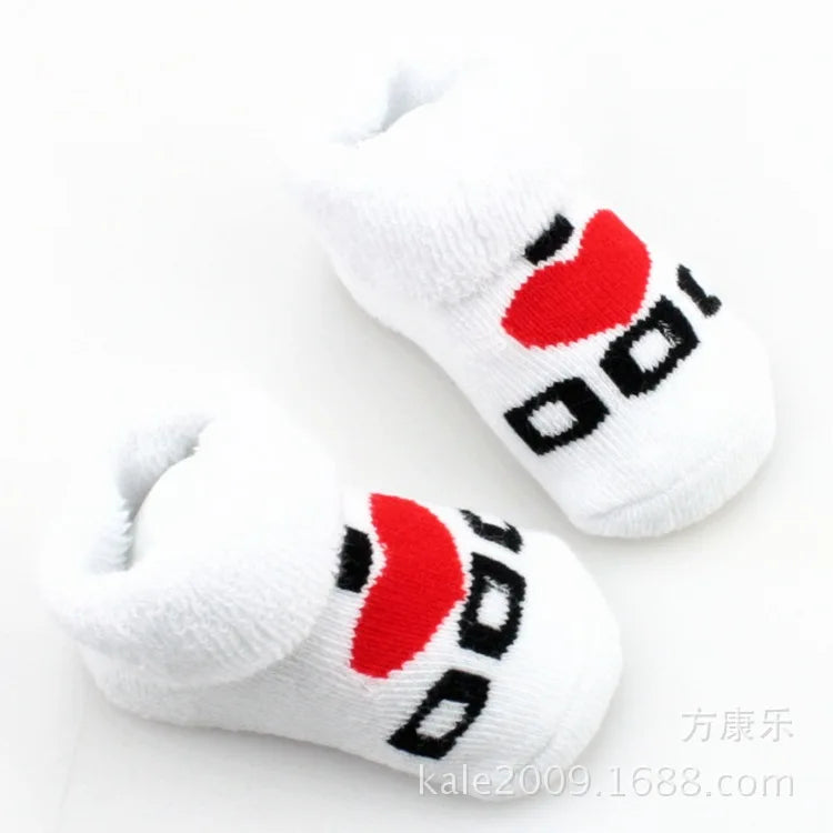 White socks with red and black designs on a white background