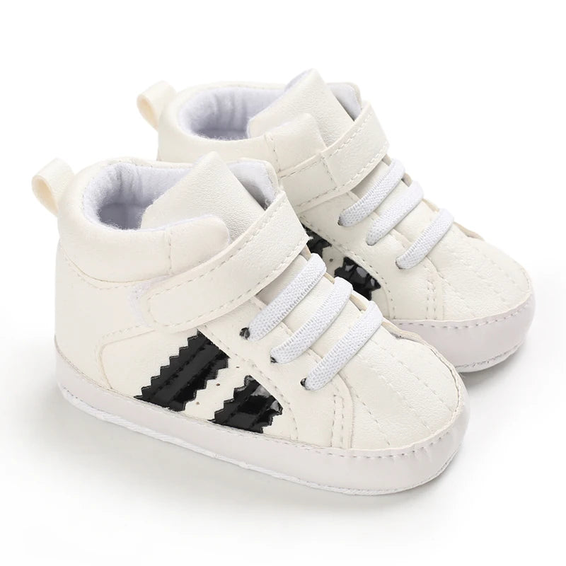 White high-top sneakers with black stripes on a white background
