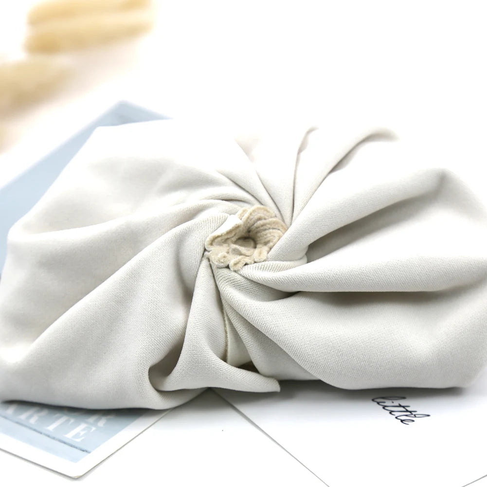 Beige fabric headband on a light background