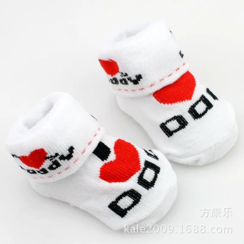 White socks with red hearts and black text on a white background