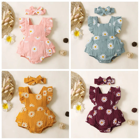 Four baby rompers in pink, blue, yellow, and purple with floral patterns on a beige background.