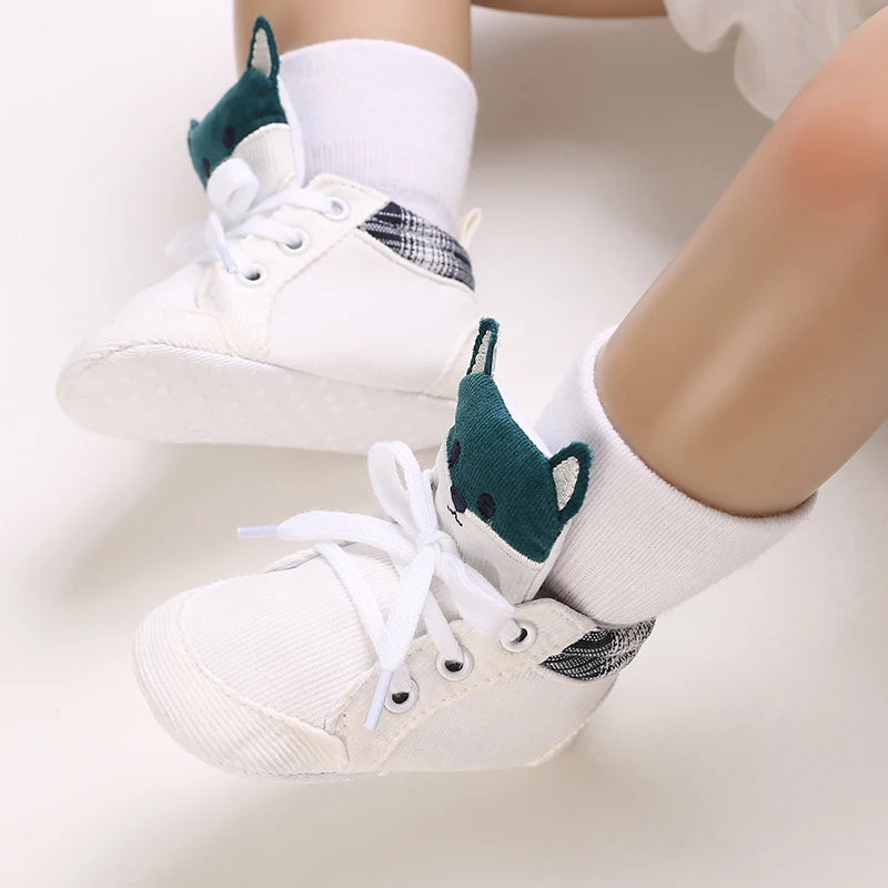 White sneakers with green accents worn by a person on a white background