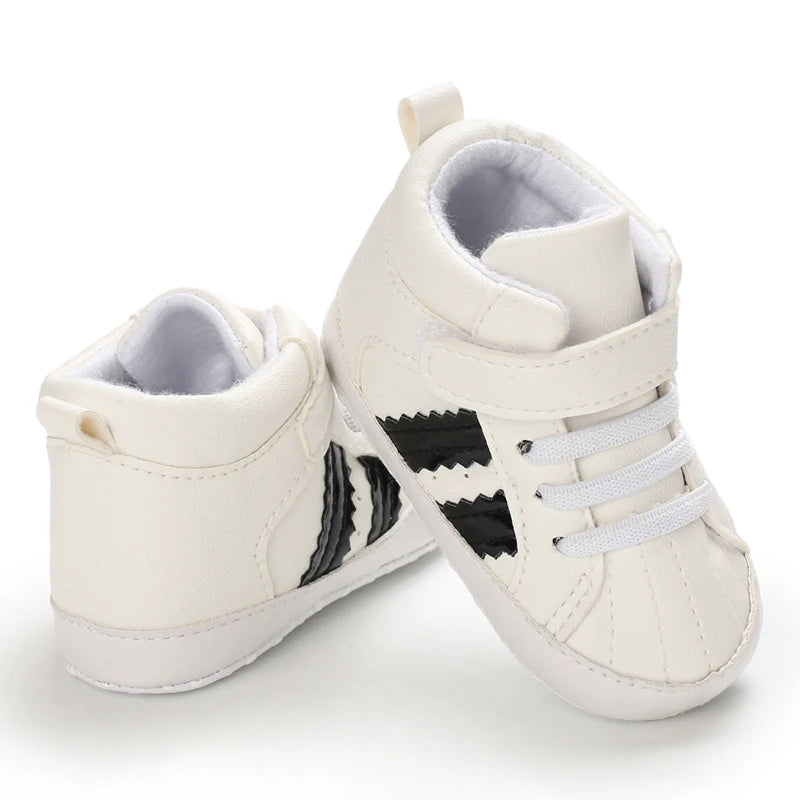 White high-top sneakers with black stripes on a white background