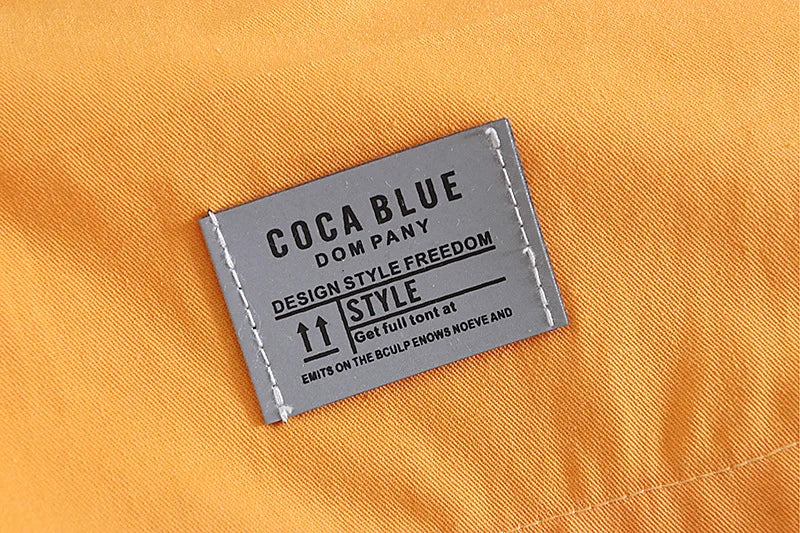 Coca Blue label on a yellow fabric background