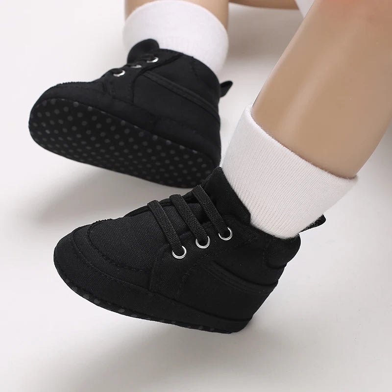 Black shoes worn with white socks on a light background