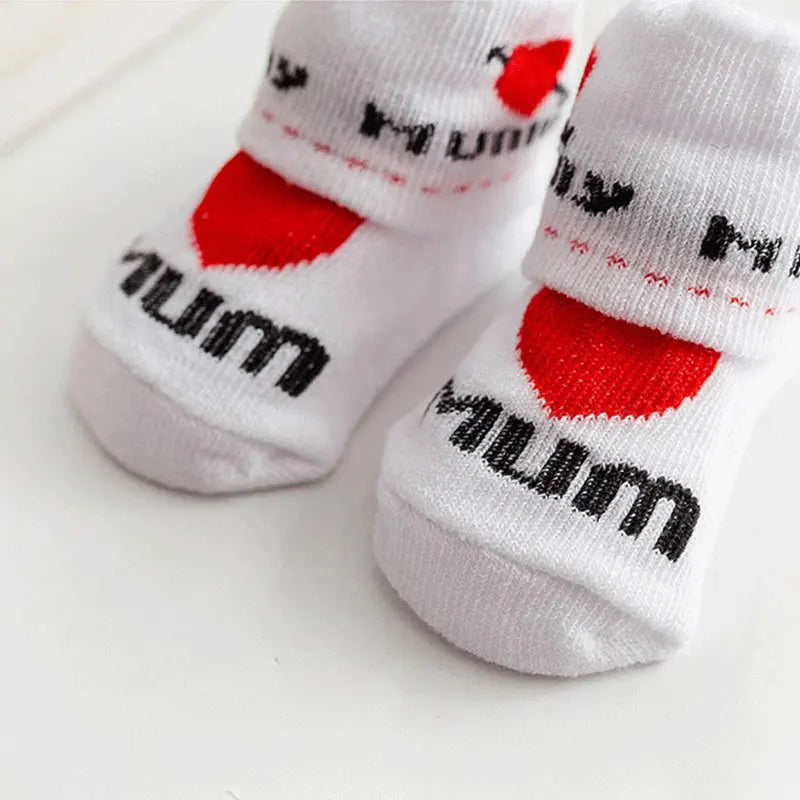 White socks with red hearts and black text on a white background