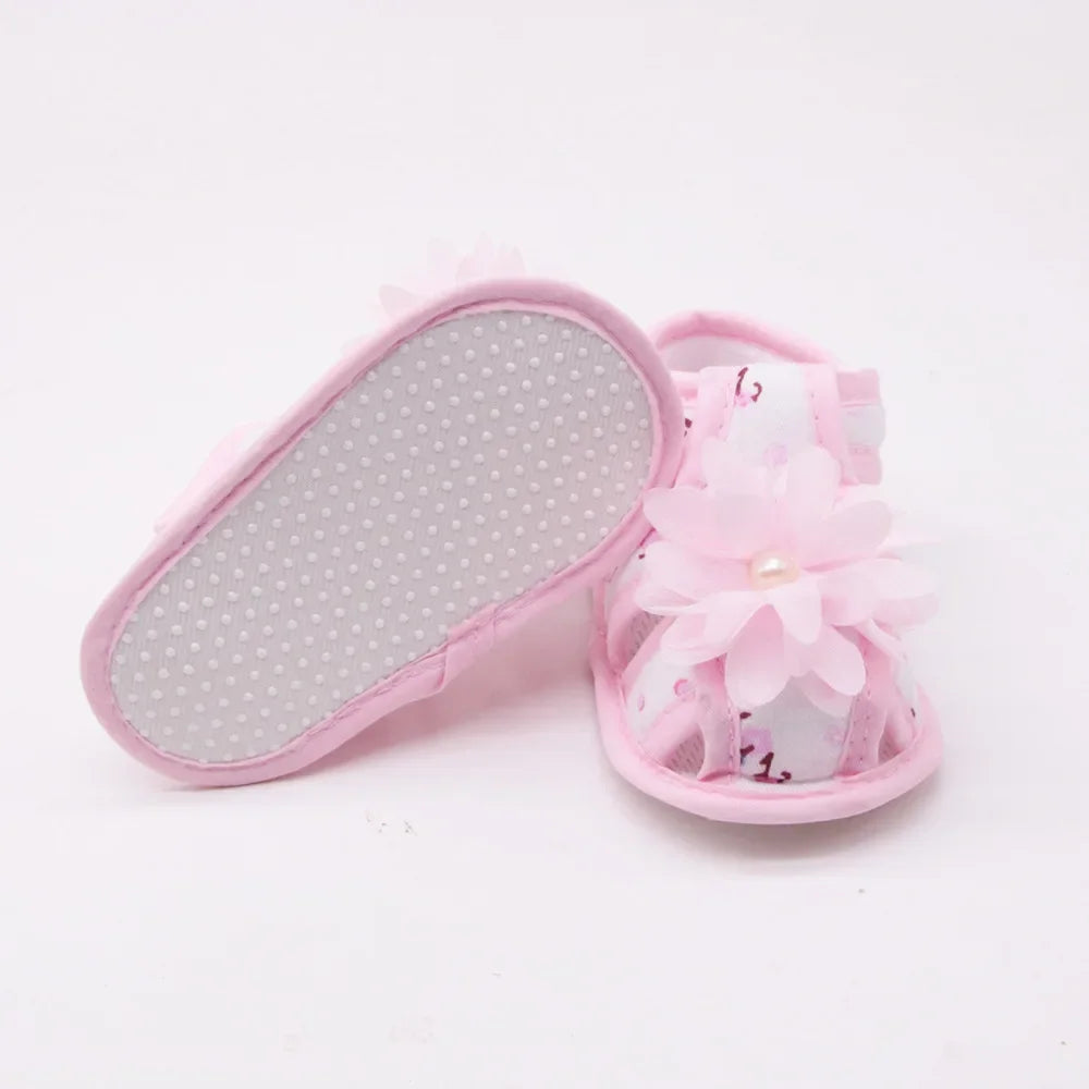 Pink sandal with gray sole on a white background