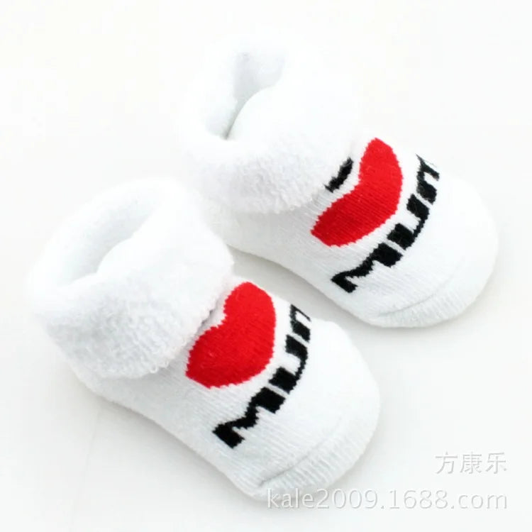 White socks with red hearts and black text on a white background