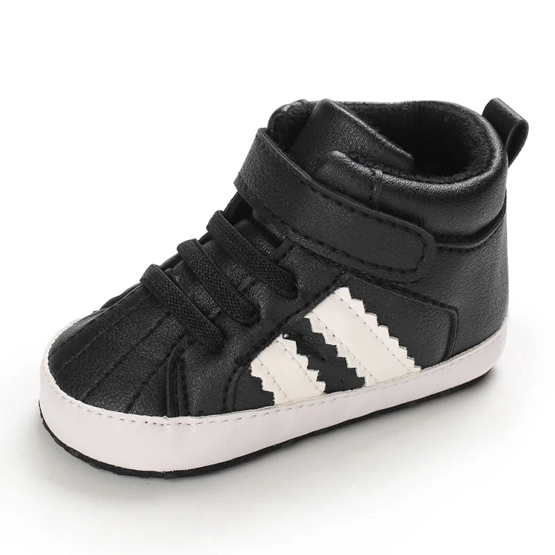 Black high-top sneaker with white stripes on a white background