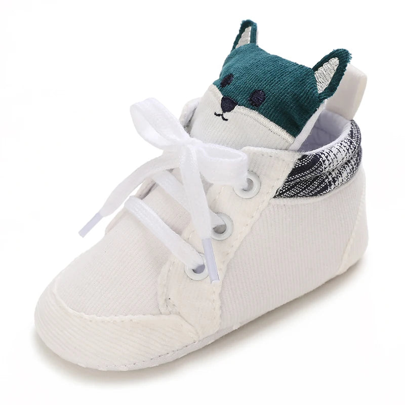 White baby shoe with a fox design on a white background