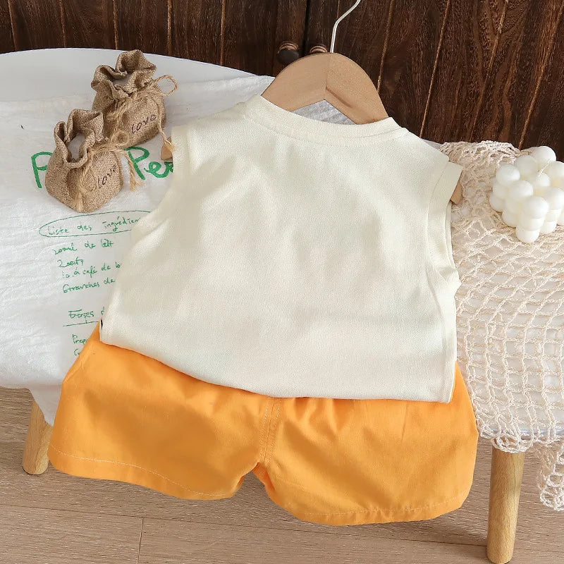 White sleeveless top and orange shorts on a wooden chair with a wooden floor background.